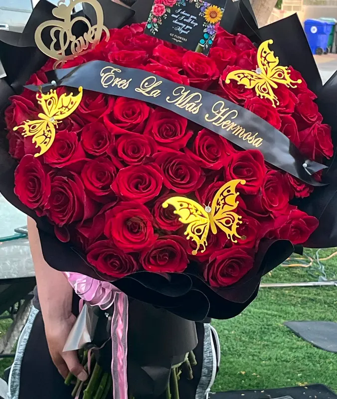 Custom red rose bouquet with a printed satin sash and gold butterflies, GZ Flowers Cathedral City